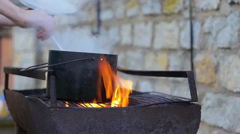 Cooking soup on fire in grill. Stock Footage 49414728
