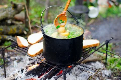 The cooking of soup on the fire Stock Photos