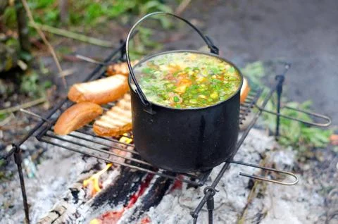 The cooking of soup on the fire Stock Photos