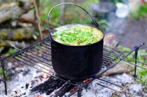 The cooking of soup on the fire Stock Photos
