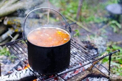 The cooking of soup on the fire Stock Photos