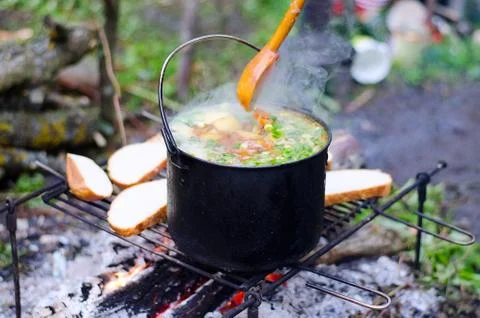 The cooking of soup on the fire Stock Photos