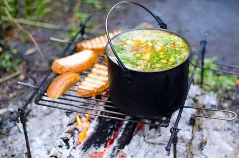 The cooking of soup on the fire Stock Photos