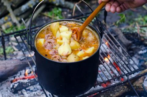 The cooking of soup on the fire Stock Photos