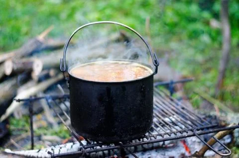 The cooking of soup on the fire Stock Photos