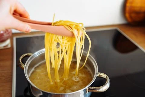 Cooking spaghetti at home Stock Photos