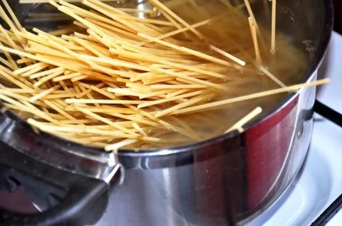Cooking spaghetti Stock Photos