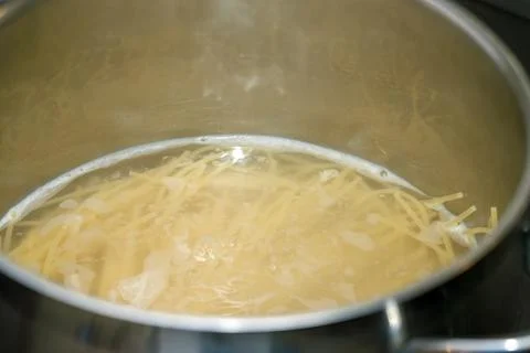 Cooking spaghetti in pot Photos