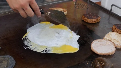 Cooking special cheeseburger with egg. Beef or pork big, lush, delicious cutlet Stock Footage 111370235