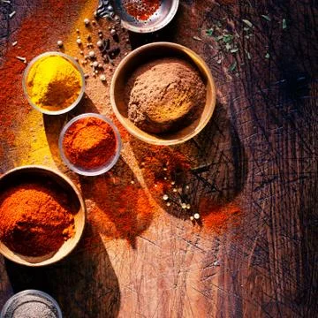Cooking with spices in a rustic kitchen Stock Photos