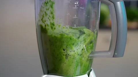 Cooking spinach smoothie in blender, side view, healthy food for everyone Stock Footage 155610177
