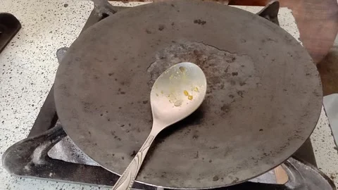 Cooking Spoon Resting on a Flat Pan Stock Footage 346746874