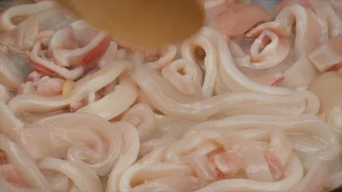 Cooking squid in a pan, close-up 動画素材 132285704
