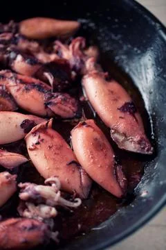 Cooking squid in a pan. High quality photo. Stock Photos