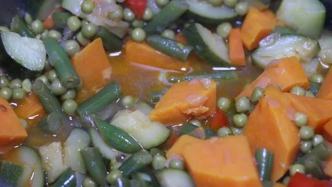 Cooking squid with vegetables in iron pot Stock Footage 107182520
