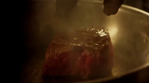 Cooking stake in slow motion Stock Footage 73605423