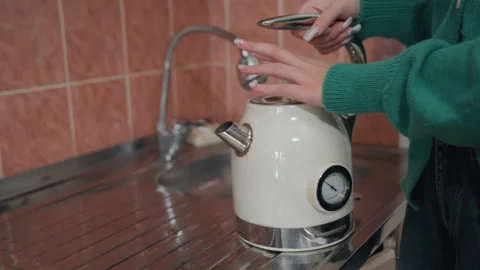 Cooking start after relocation. Unpacking and preparing morning beverage in new Stock Footage 337229448