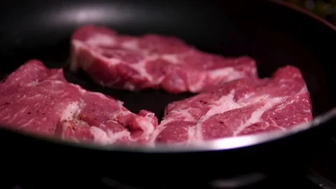 Cooking steak in cast iron pan in the Stock Video Pond5