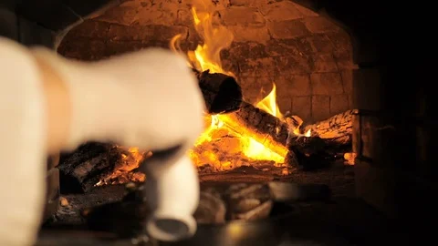 Cooking steak in a fire oven Stock Footage 106276247
