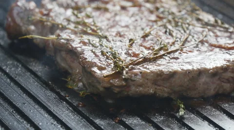 Cooking steak the grill Stock Footage 65134218