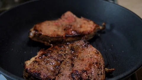 Cooking steak in a pan Stock Footage 116347256