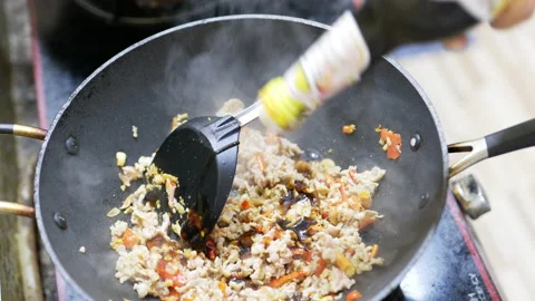 Cooking stir fried chicken with basil Stock Footage 229827535