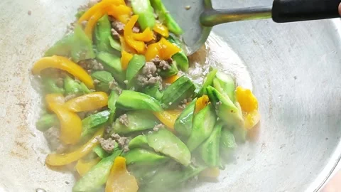 Cooking stir-fried luffa with pork in wok. Stock Footage 341865972