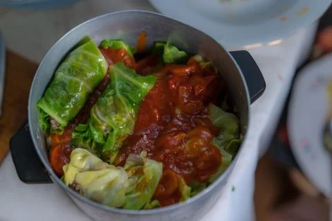 Cooking stuffed cabbage. Making minced meat in cabbage leaves. Stock-Fotos