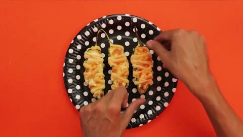 Cooking stuffed mummy jalapenos Stock Footage 242958402