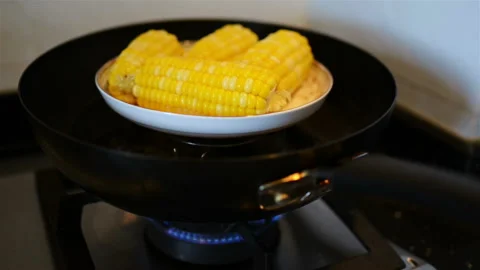 Cooking sweet corn on a pan Stock Footage 90024571