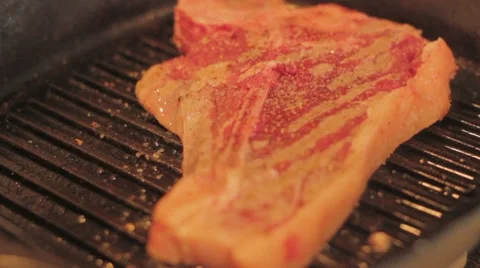 Cooking T-Bone Steak Stock Footage