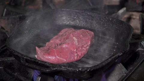 Cooking tasty stake on a pan Stock Footage 73510052