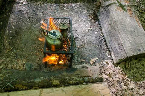 Cooking Tea in Camping Stock Photos