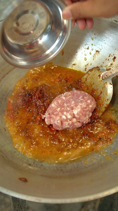 Cooking Thai food: preparing and stir-frying northern Thai chili paste with minc Stock Footage 341865343