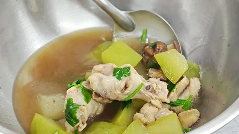 Cooking Thai winter melon soup with chicken in steel pot. Stock Footage 342027869