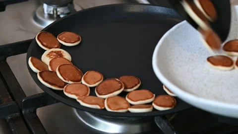 Cooking tiny pancake cereal for breakfast. 動画素材 149009605