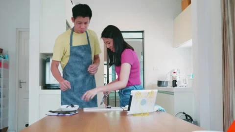 Cooking Together: A Fun and Engaging Activity in the Kitchen Stock Footage 313832563