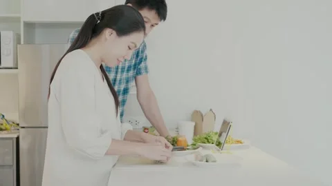 Cooking Together: A Joyful Kitchen Experience Stock Footage 314570192