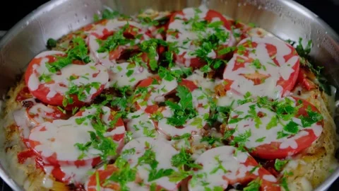 Cooking a Tomato and Herb Dish in an Electric Cooker Video stock 341443666