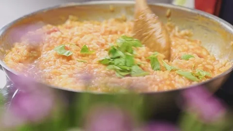 Cooking tomato risotto in a frying pan. Stock Footage 159399548