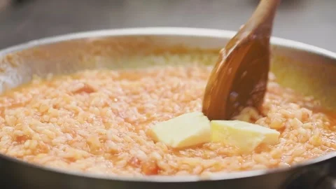 Cooking tomato risotto in a frying pan. Stock Footage 159399600