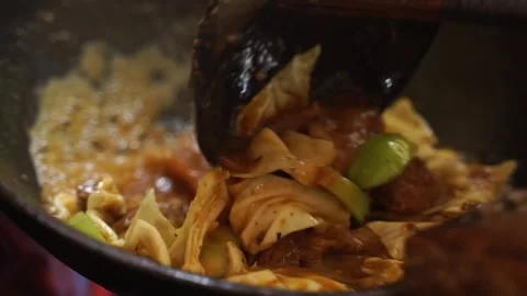 Cooking tongseng meat while stirring Stock Footage 270347155