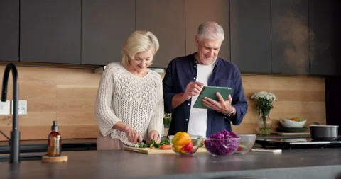 Cooking, tutorial or old couple in kitchen with tablet, food blog or connection Stock Footage 336856867