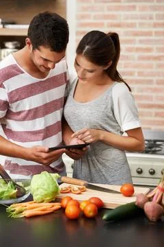 Cooking tutorial, tablet and couple in kitchen for healthy food or vegetables Stock Photos