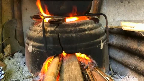 Cooking using a traditional stove Stock Footage 279323653