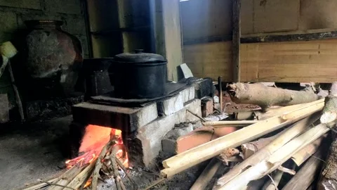 Cooking using a traditional stove. using firewood Stock Footage 285435543