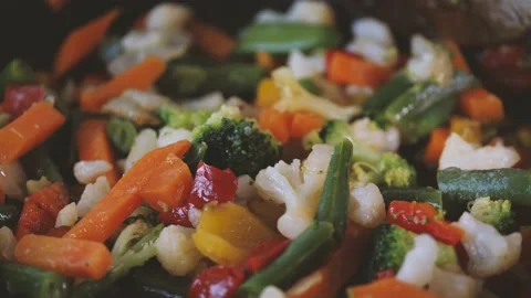 Cooking vegetable, close up of mixture of carrots, broccoli, cabbage in a pan.  Stock Footage 144261204