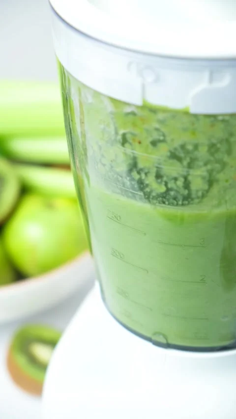 Cooking vegetable fruit smoothie in blender, the process of grinding ingredients Stock Footage 274158633