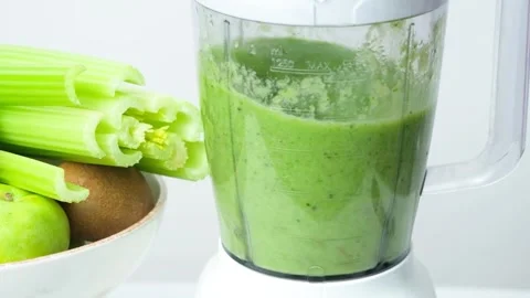 Cooking vegetable fruit smoothie in blender, slow motion of the process of Stock Footage 274446022