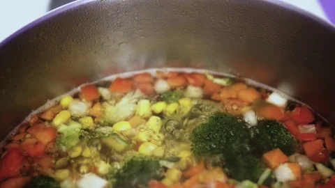 Cooking vegetable mix in pan. Stirring with spoon. Copy space Stock Footage 102586745